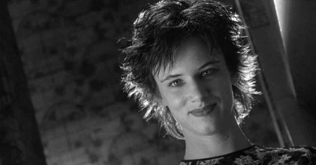 Black and white close up of Mallory Knox from Natural Born Killers, her composed expression contrasting with the violent actions associated with the character.